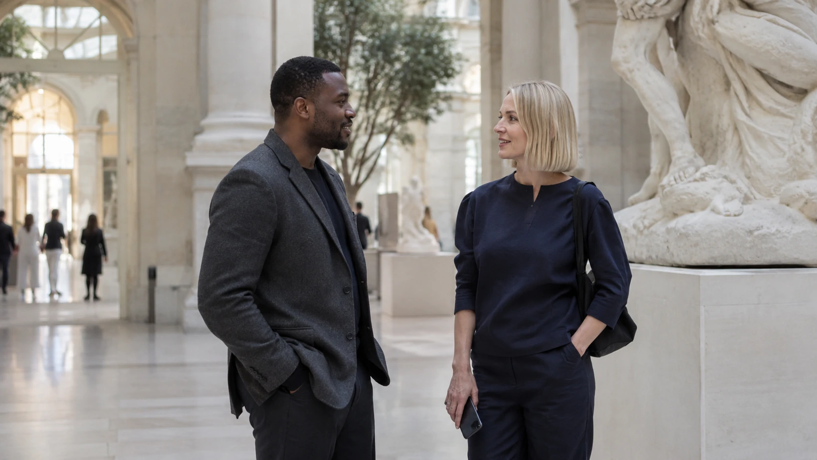 Two professionals meeting in a museum atrium
